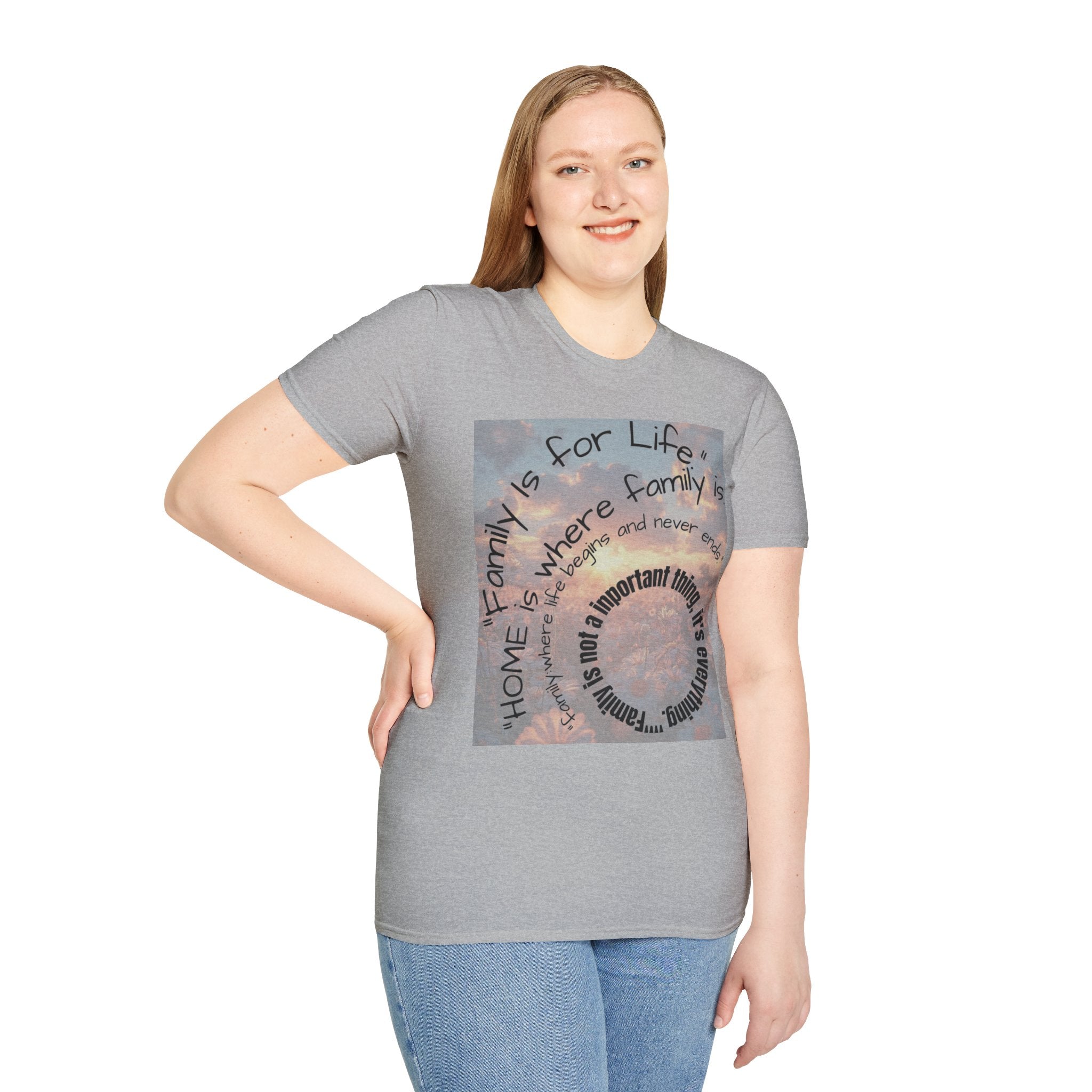 Person wearing a gray t-shirt with a graphic design and text.