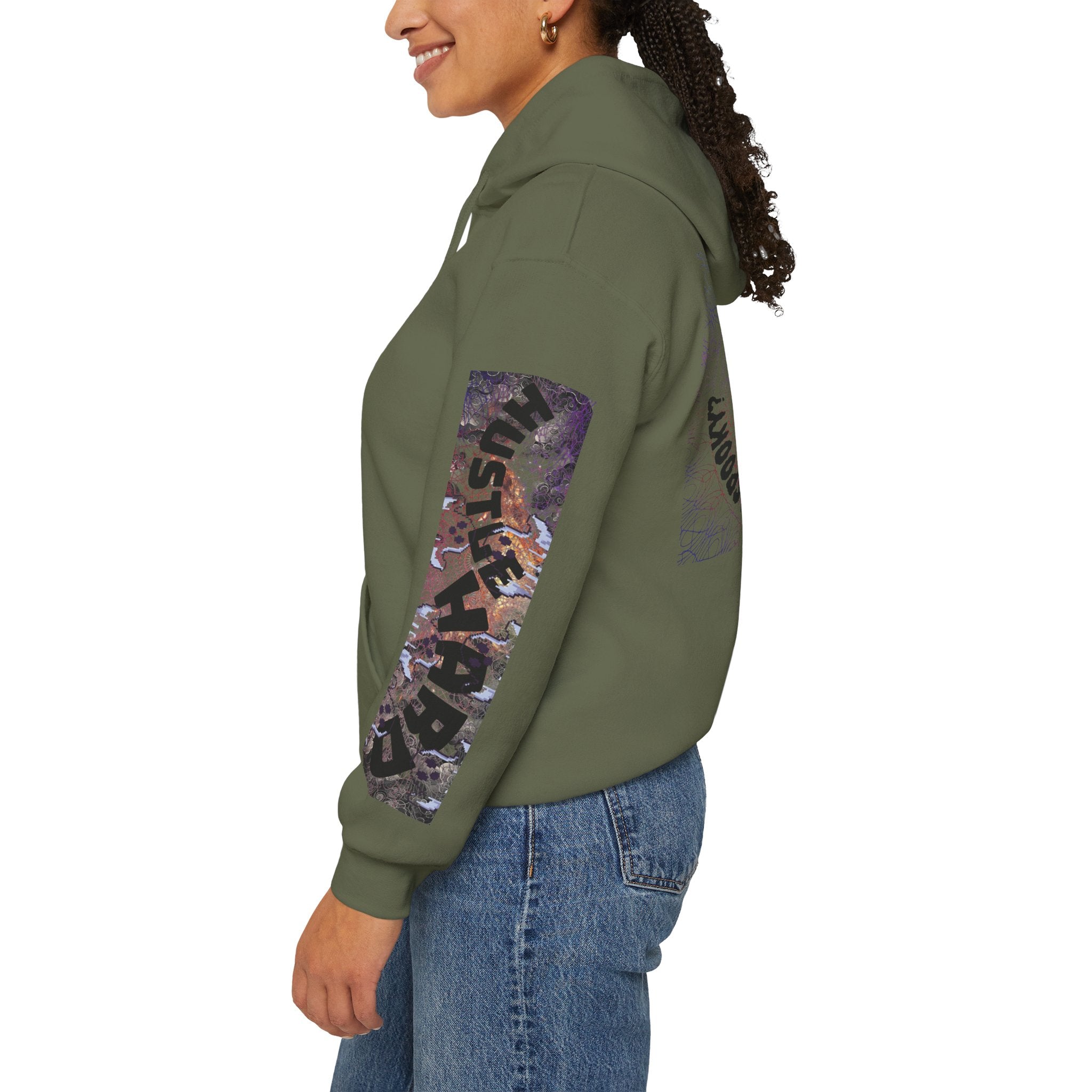 Person wearing a green hoodie with a colorful graphic on the sleeve against a white background
