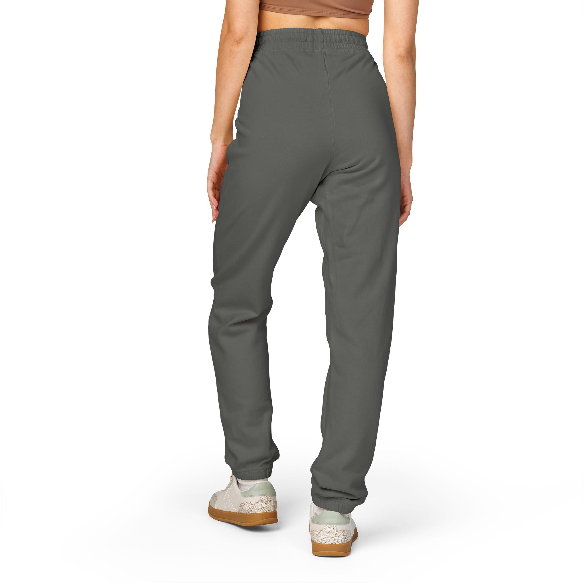 Person wearing gray pants on a white background