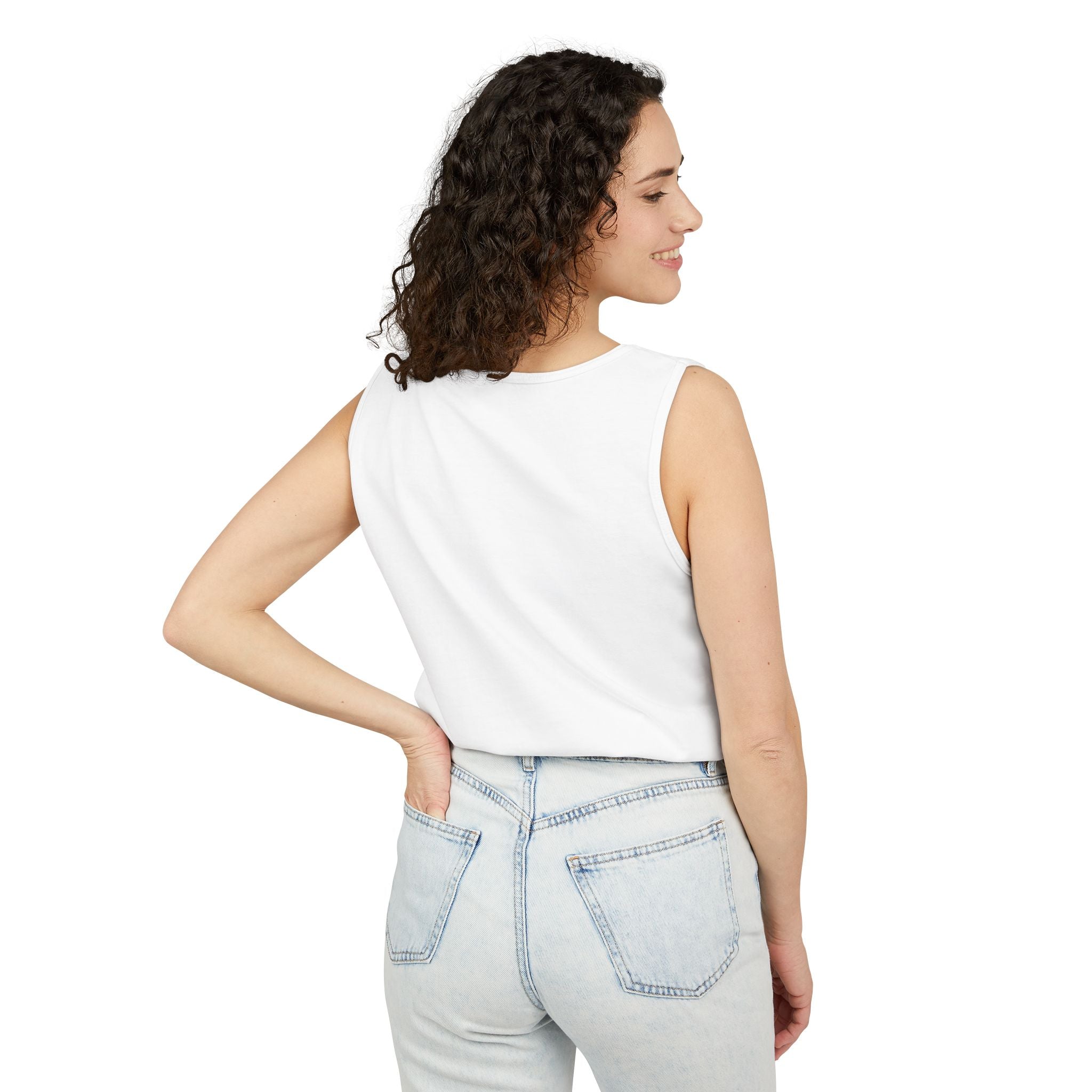 Woman wearing a white sleeveless top and light blue jeans on a white background