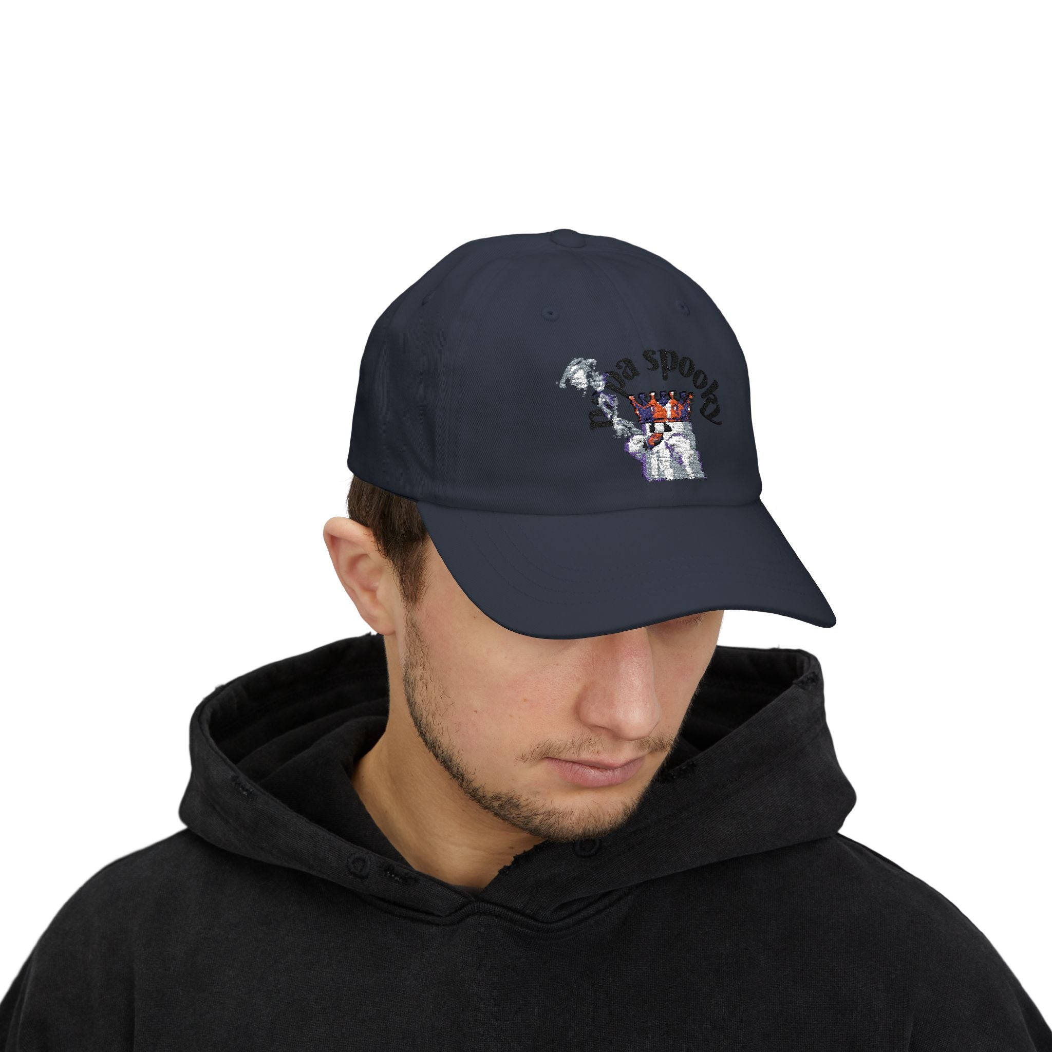 Person wearing a black cap with a logo on a white background