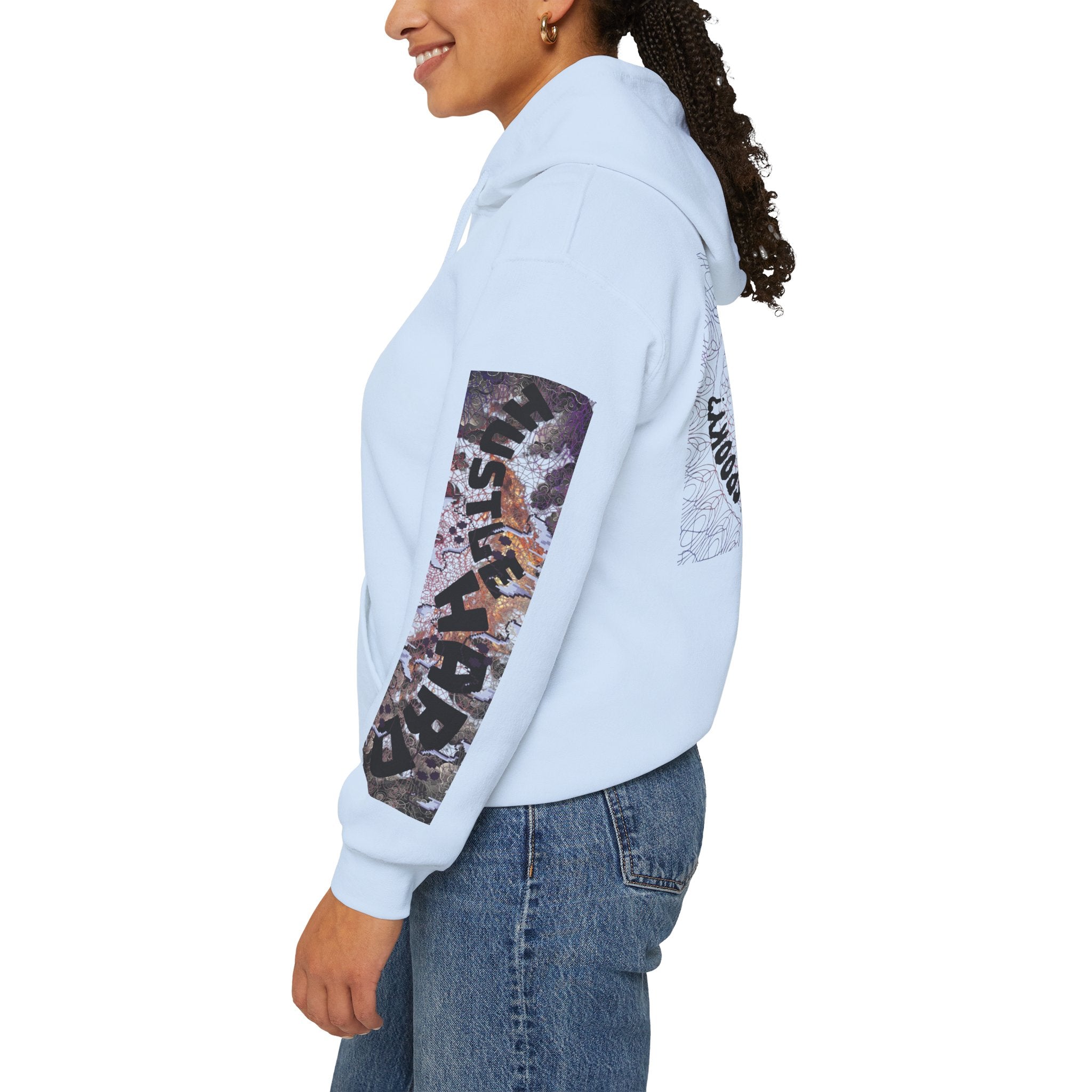 Person wearing a light blue hoodie with a colorful design on the sleeve against a white background