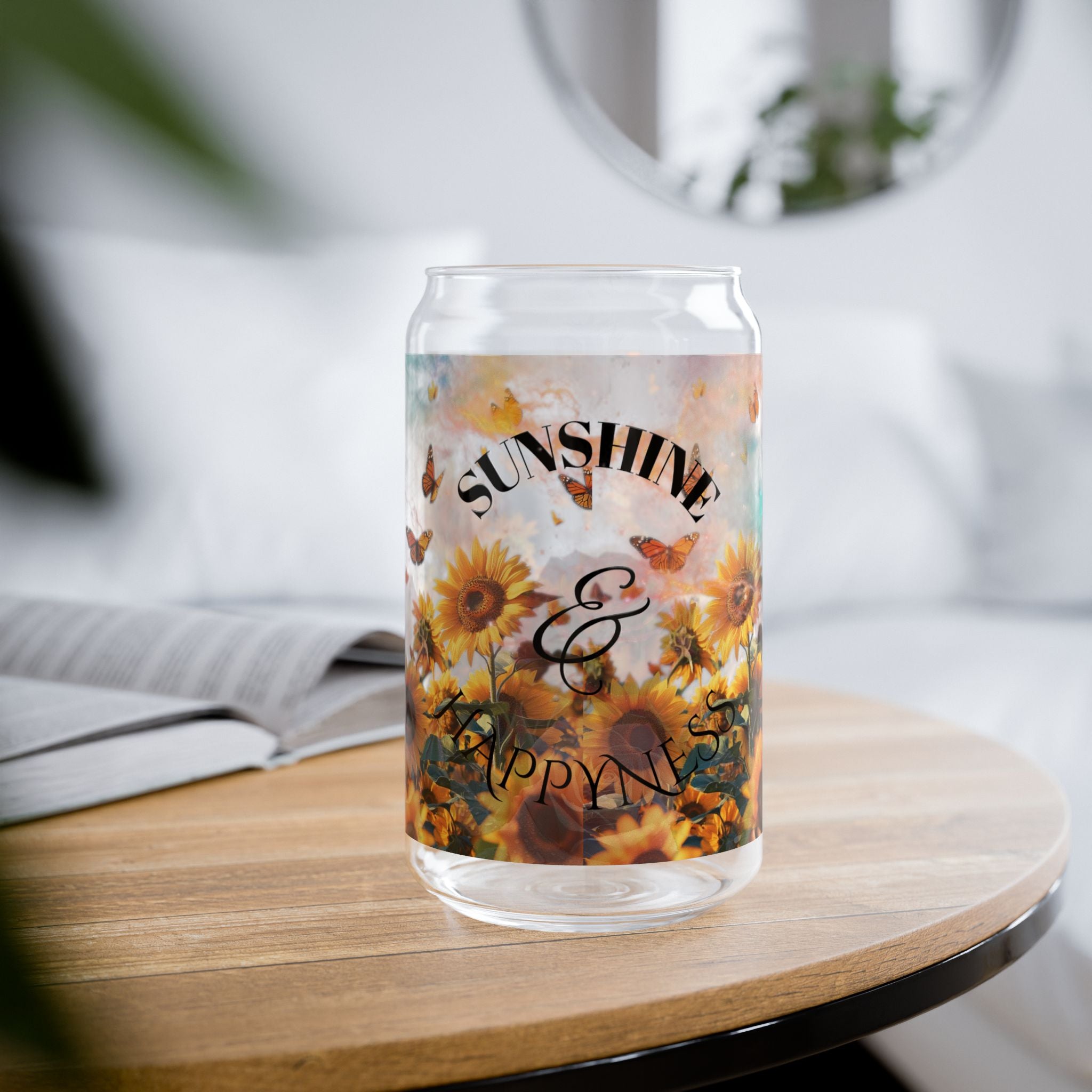 Clear glass with floral design and text 'Sunshine & Happiness' on a wooden table.