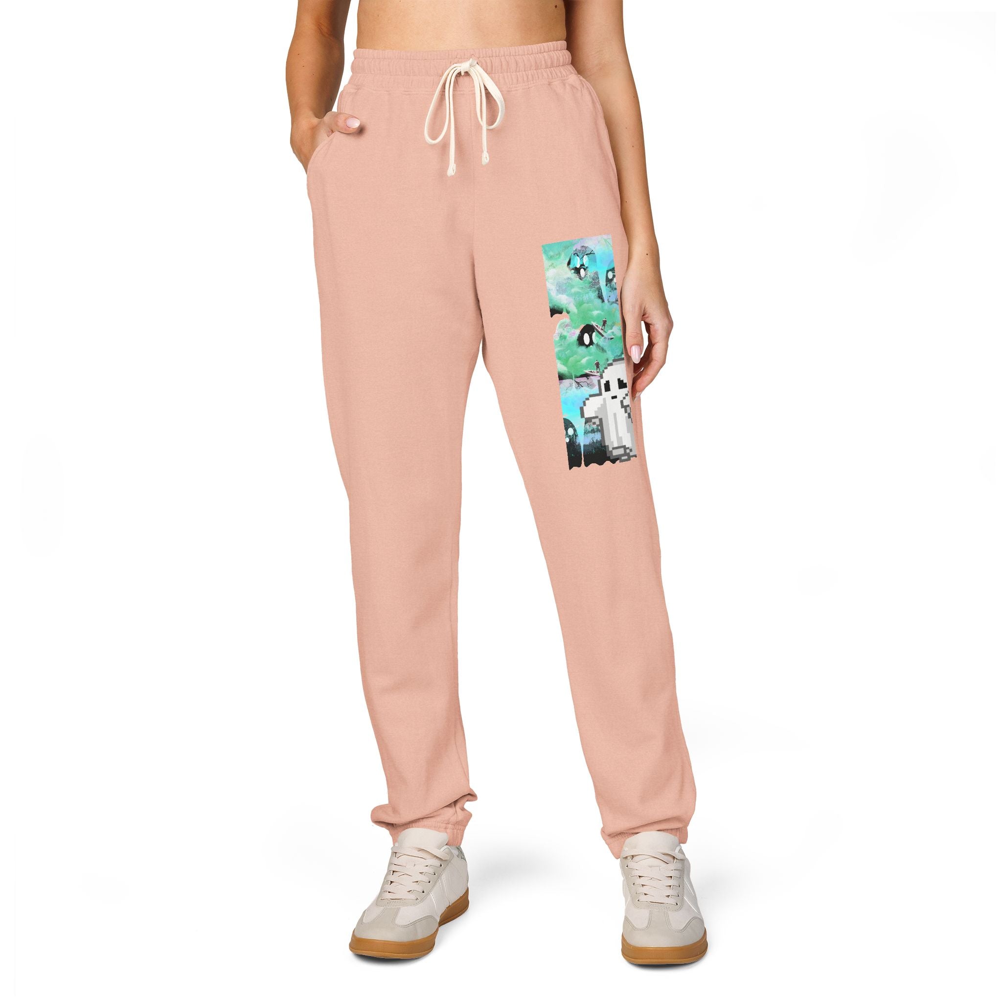 Pink sweatpants with a cartoon character design on a white background