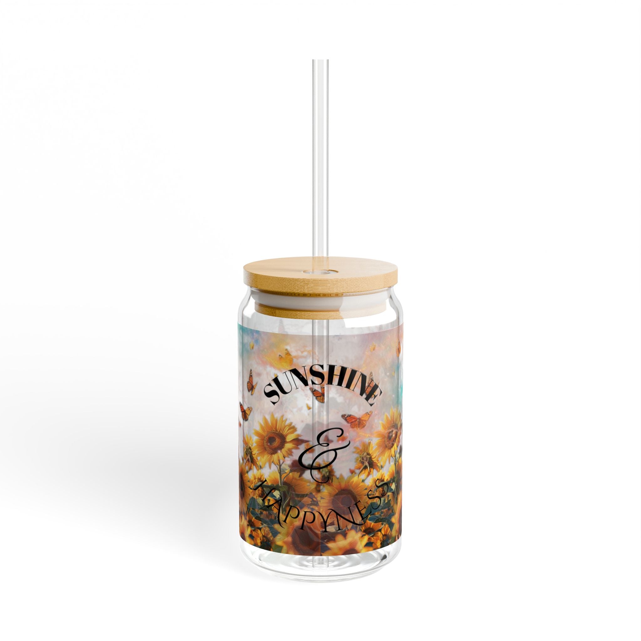 Clear tumbler with sunflower design and wooden lid on a white background