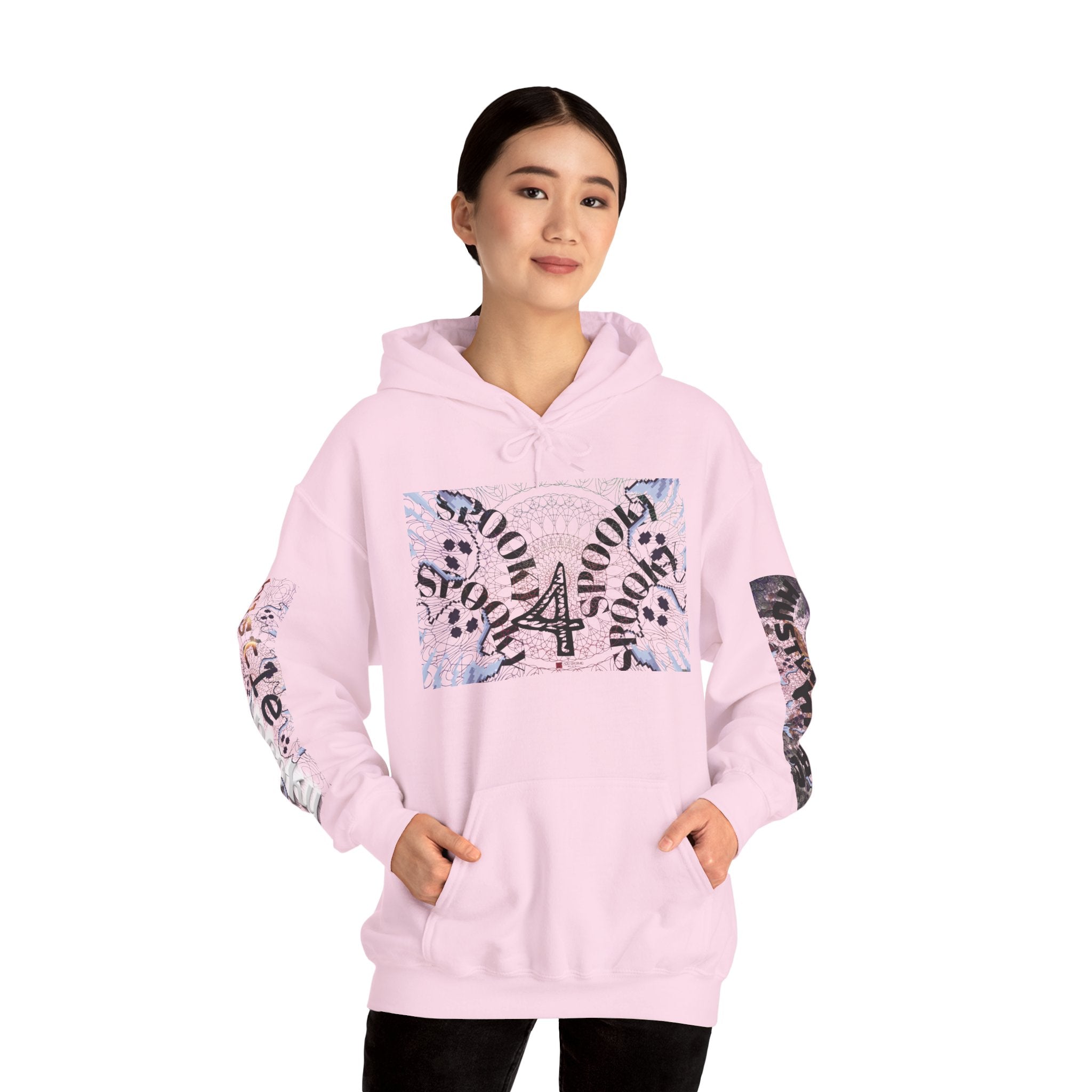 Person wearing a pink hoodie with graphic designs on a white background