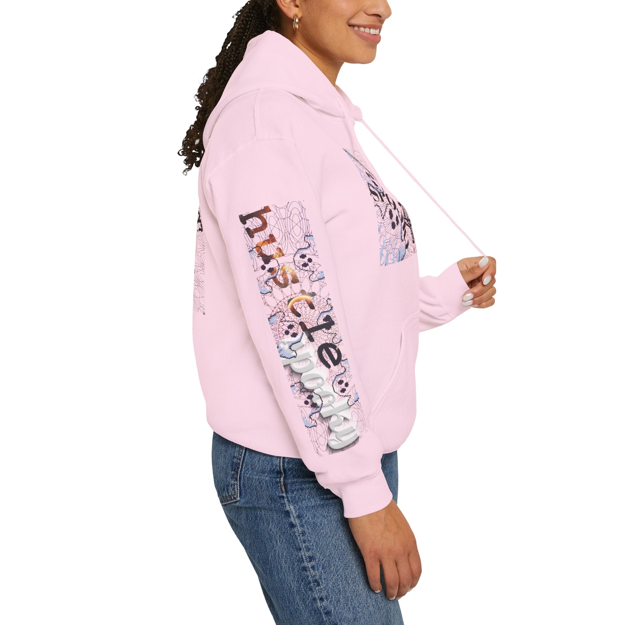 Person wearing a pink hoodie with colorful text and graphics on a white background