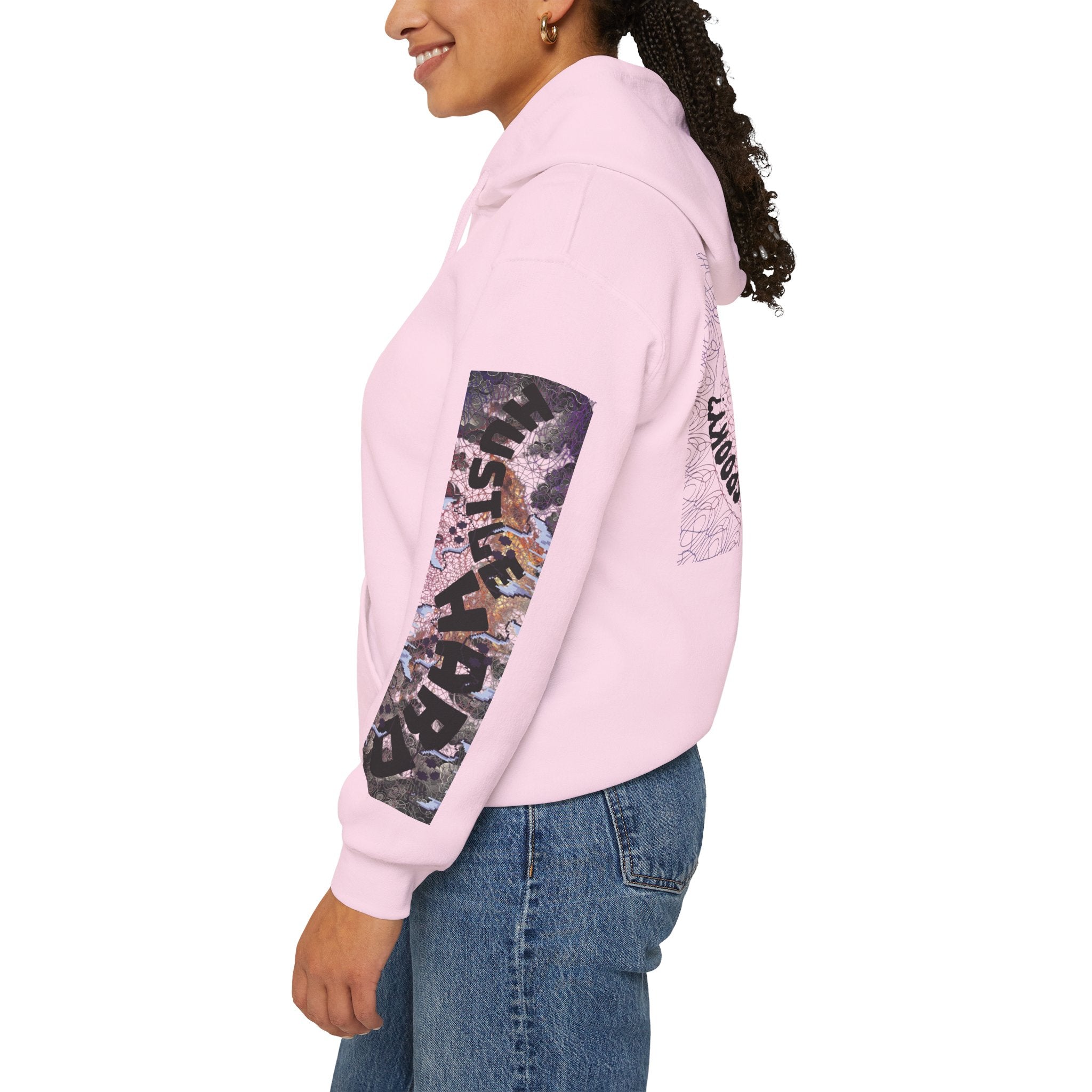 Person wearing a pink hoodie with graphic design on a white background