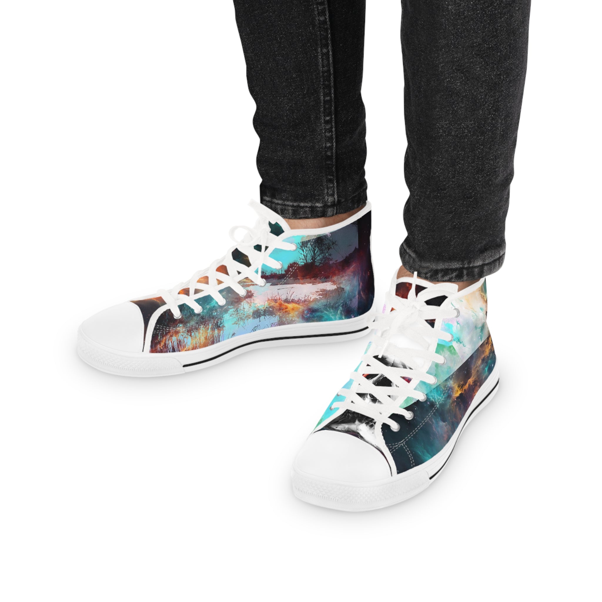 Colorful sneakers with abstract design worn with black jeans on a white background