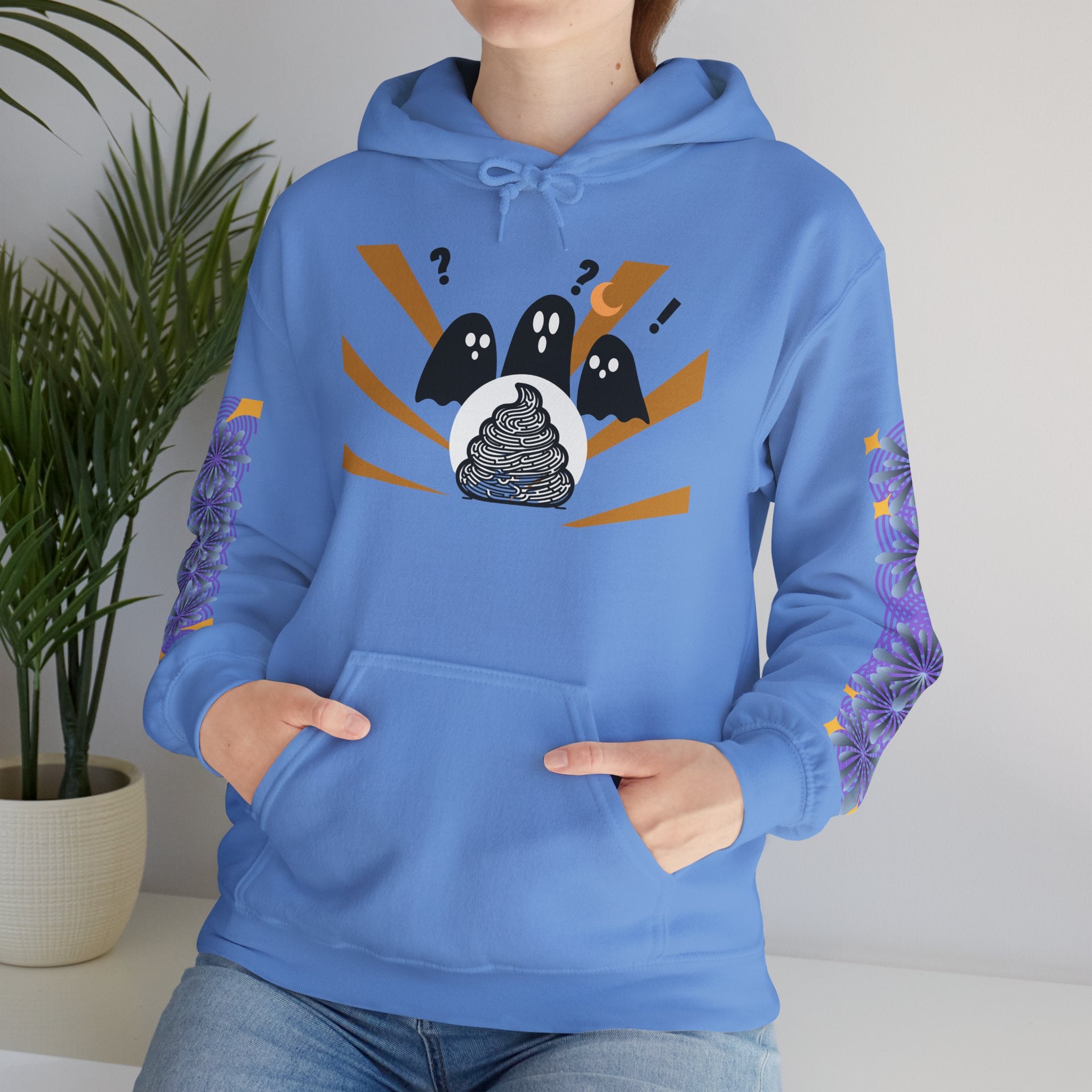 Person wearing a blue hoodie with a graphic design of three ghosts and a black circle.