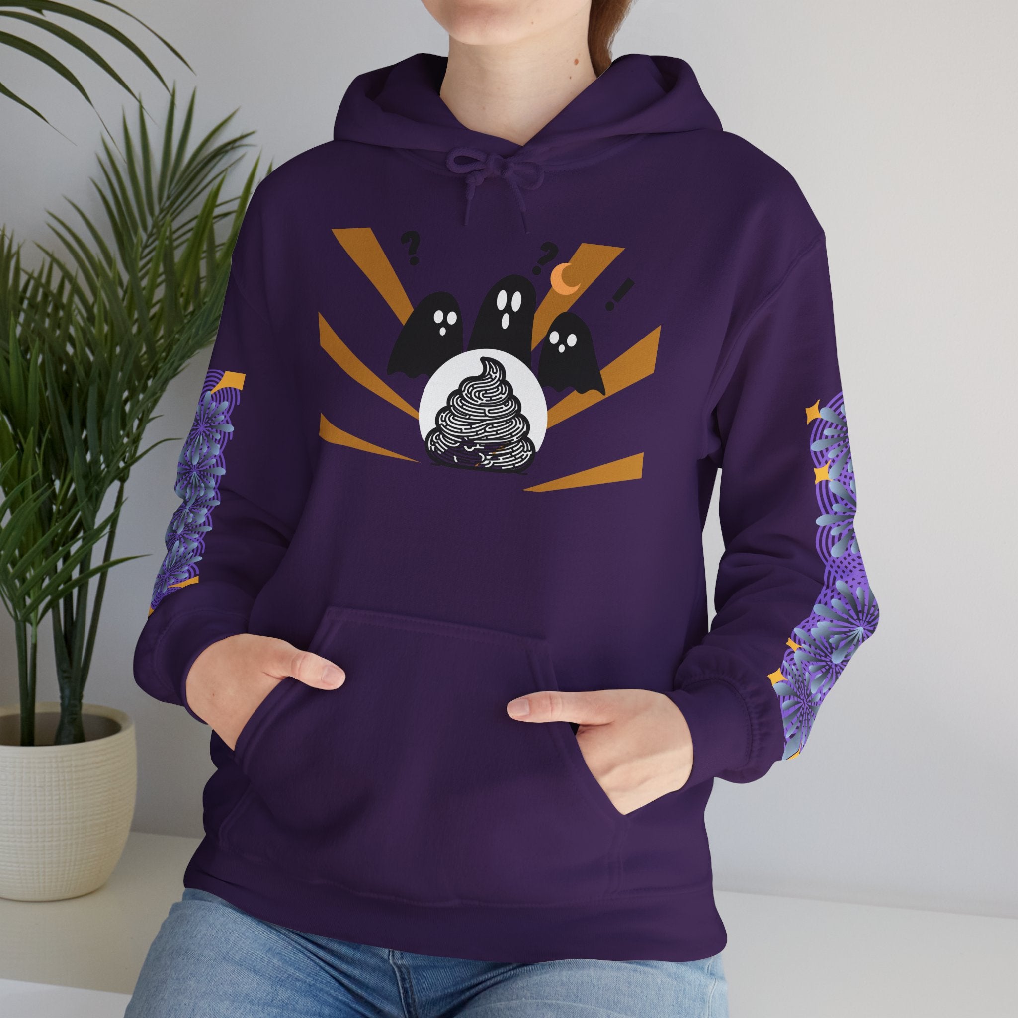 Person wearing a purple hoodie with a graphic design on a plain background