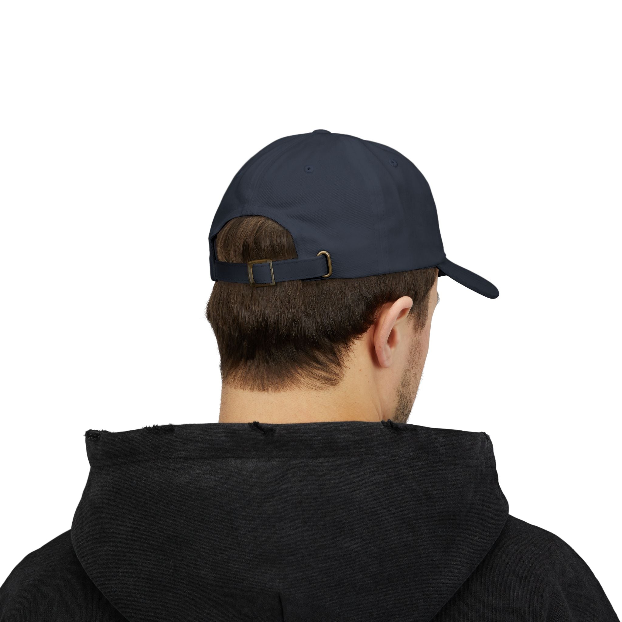 Person wearing a navy blue cap from behind on a white background