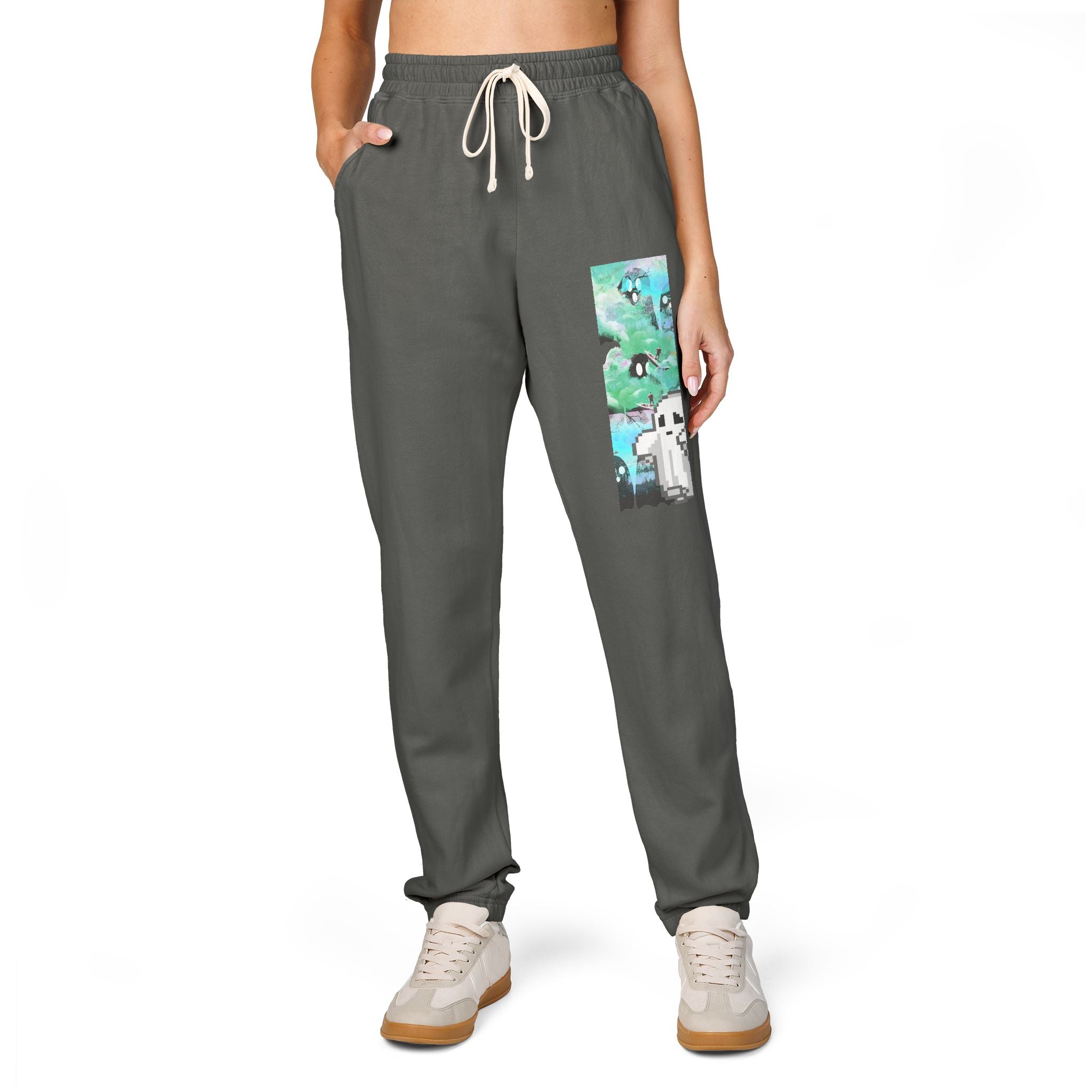 Person wearing gray sweatpants with a graphic design on a white background