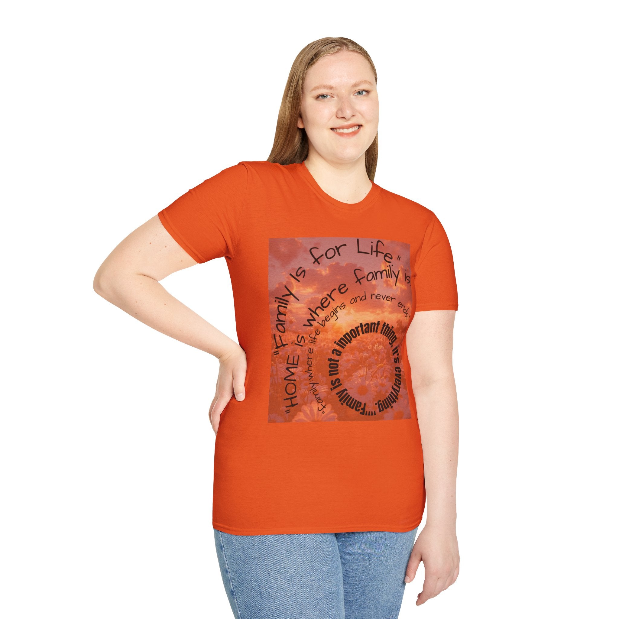 Person wearing an orange t-shirt with a graphic design and text.
