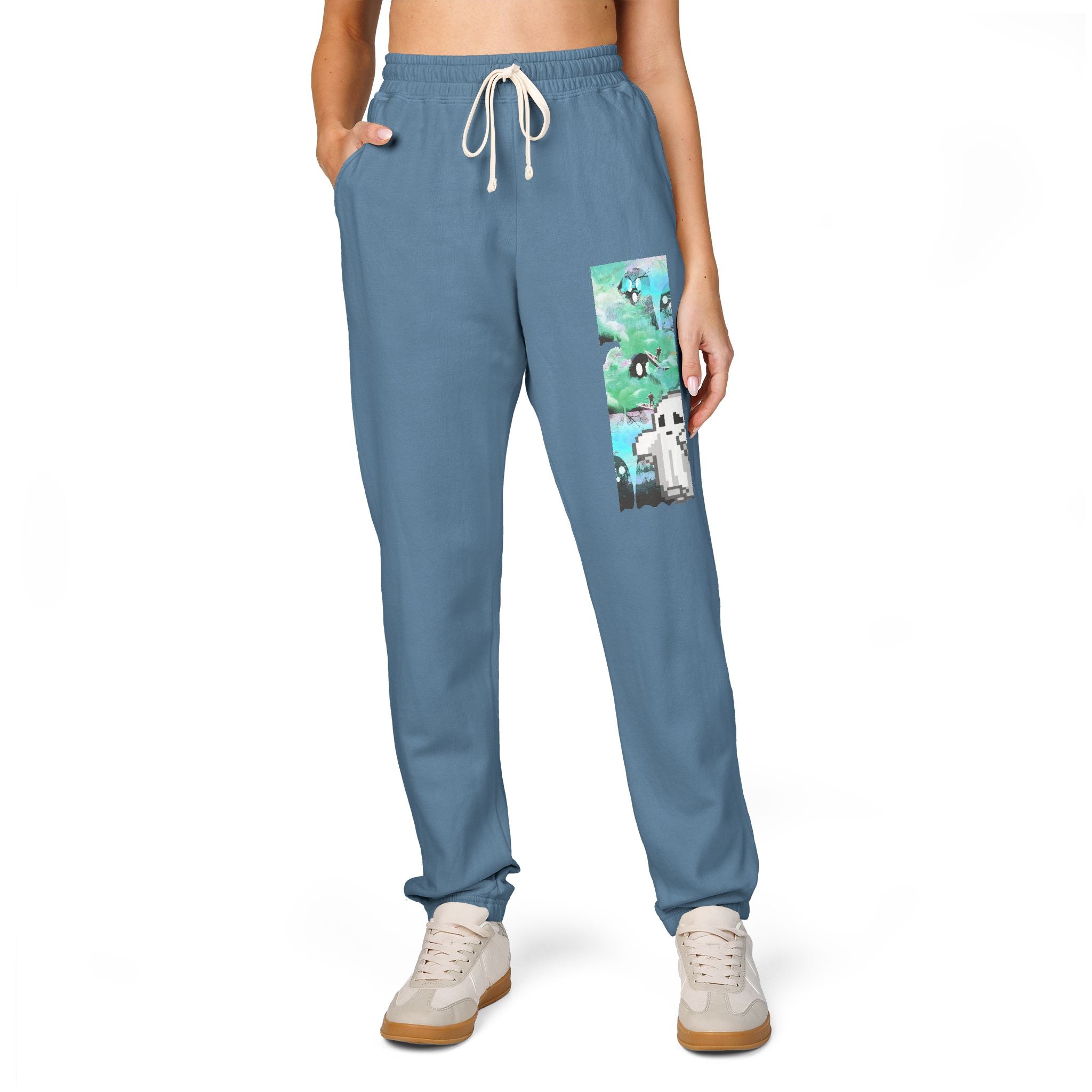 Blue sweatpants with a cartoon character patch on a white background