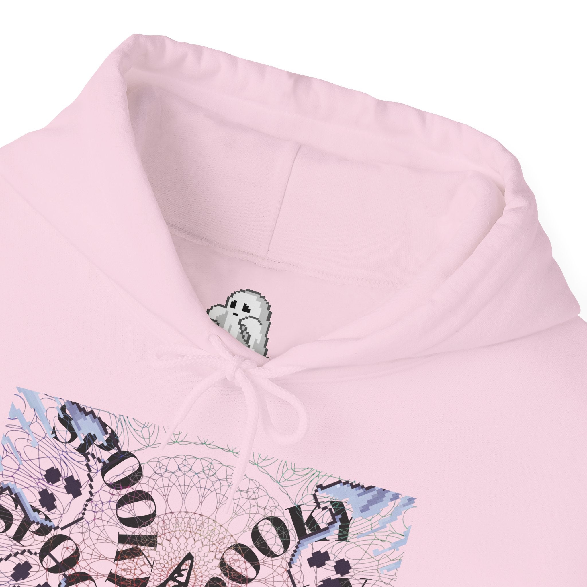 Close-up of a pink hoodie with a graphic design on a white background