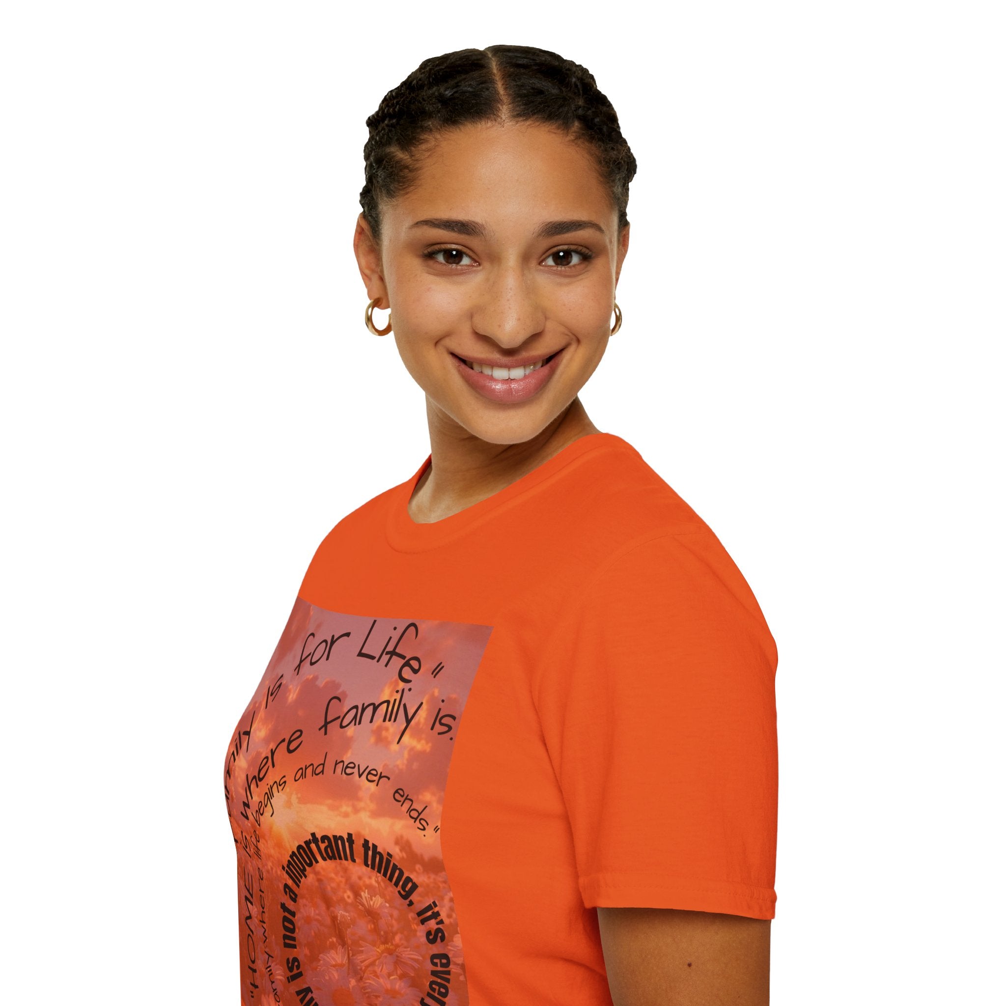 Person wearing an orange t-shirt with a printed design on a white background