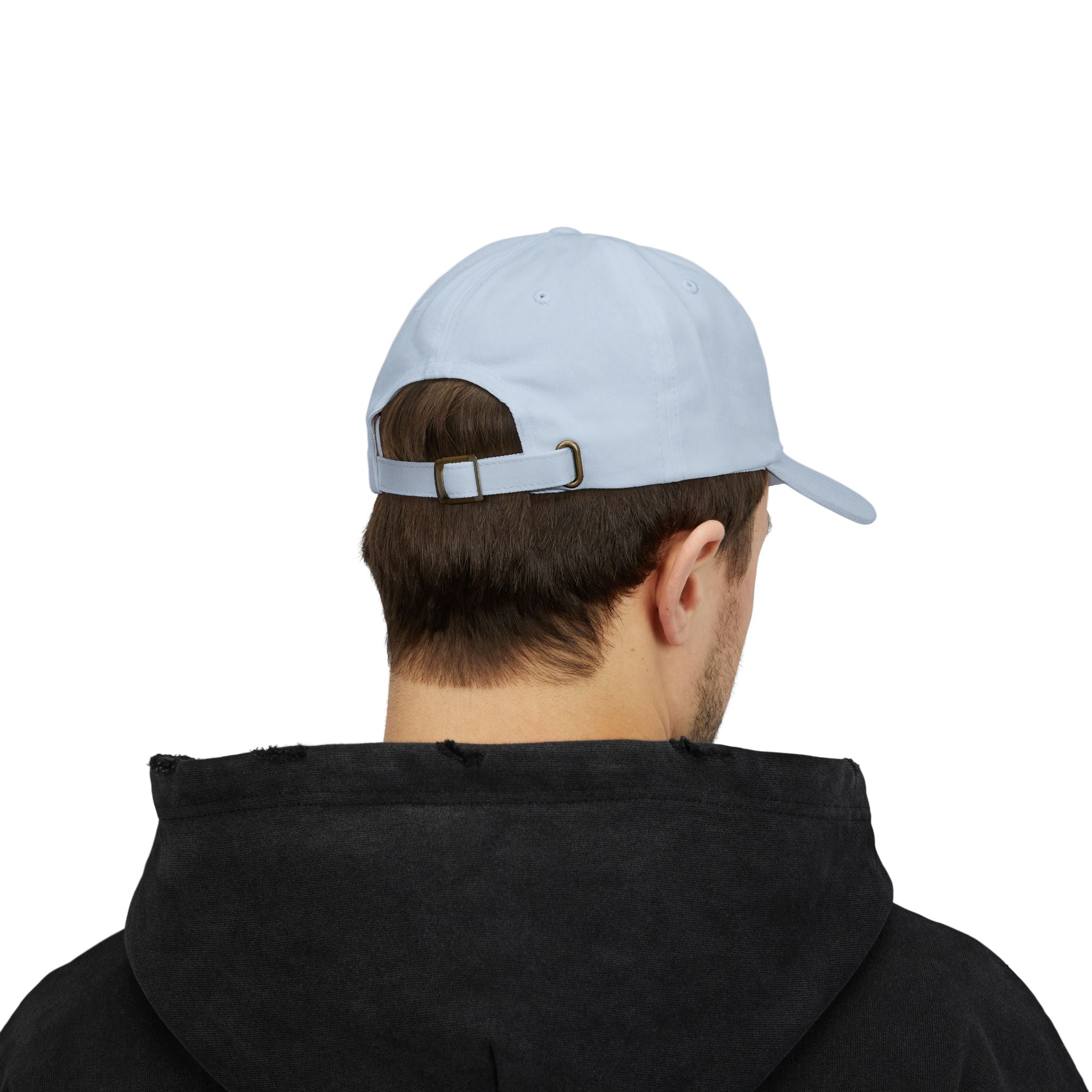 Person wearing a light blue cap and black hoodie on a white background