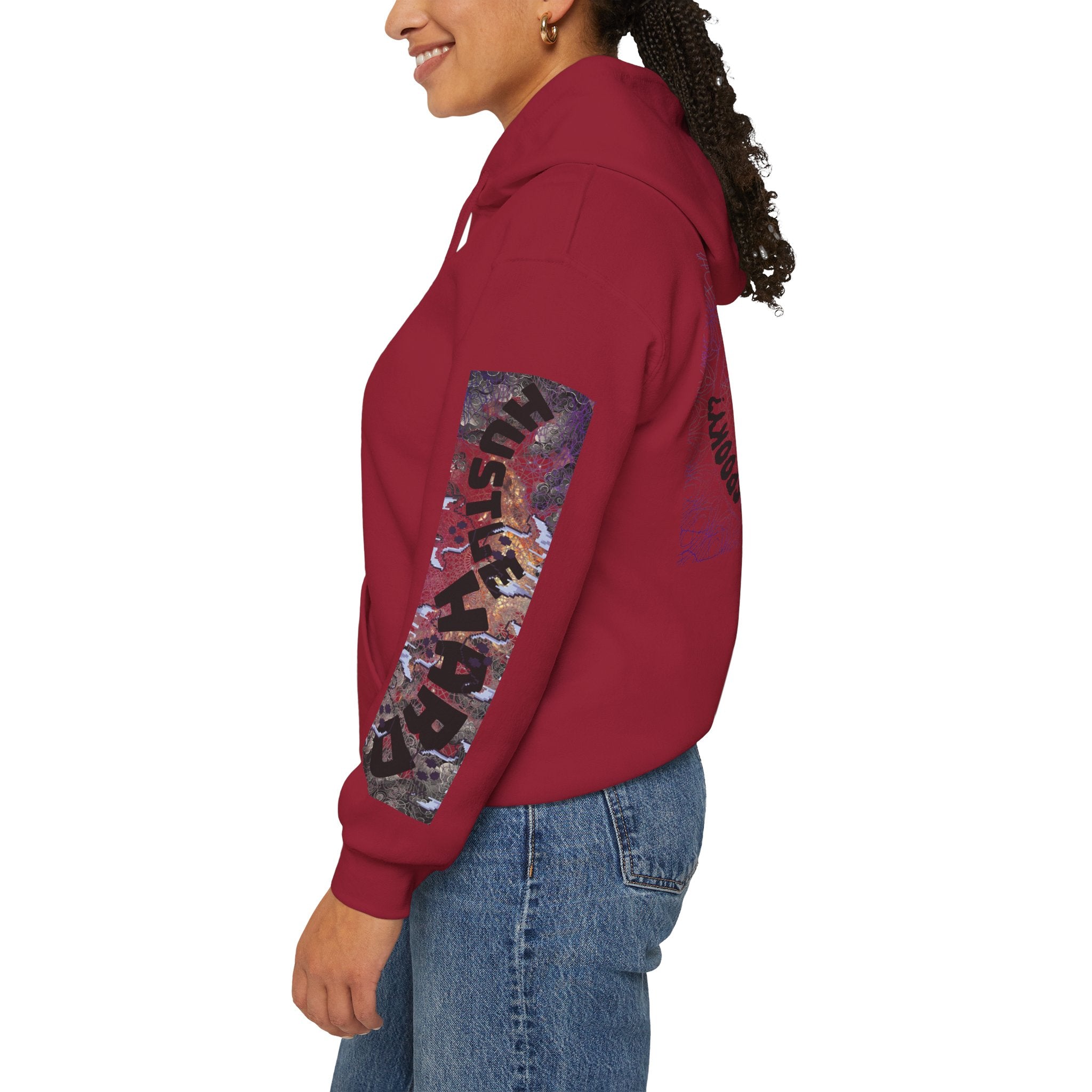 Red hoodie with colorful graphic design worn by a person on a white background